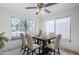 Dining room with dining set and large windows overlooking the backyard at 3351 W Via Del Sol Dr, Phoenix, AZ 85027