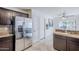 Kitchen with granite countertops, stainless steel appliances and adjacent hallway at 3351 W Via Del Sol Dr, Phoenix, AZ 85027