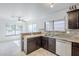 Kitchen with granite countertops, stainless steel appliances and open concept layout at 3351 W Via Del Sol Dr, Phoenix, AZ 85027