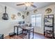 Office space with a dark wood floor, a large window, desk, and storage shelving at 3351 W Via Del Sol Dr, Phoenix, AZ 85027
