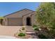 Charming single-story home features a low-maintenance desert landscape and neutral color palette at 34009 N 29Th Dr, Phoenix, AZ 85085