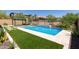 Beautiful backyard swimming pool featuring a gazebo, lush landscaping, and outdoor seating area at 34009 N 29Th Dr, Phoenix, AZ 85085