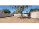 Large backyard with mature tree, offering a private and tranquil outdoor space, ideal for relaxation at 3541 W Monona Dr, Glendale, AZ 85308