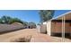 View of the backyard featuring functional sheds and ample space for landscaping, perfect for outdoor enjoyment at 3541 W Monona Dr, Glendale, AZ 85308