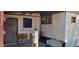 Exterior view displaying a side access door and necessary utility features, offering practical renovation potential at 3541 W Monona Dr, Glendale, AZ 85308