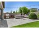 Inviting backyard with outdoor kitchen, gas fire pit, and plush, artificial turf lawn at 3822 E Canyon Pl, Chandler, AZ 85249