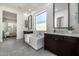 Bright bathroom featuring a soaking tub, dual vanities, and tiled floors at 3822 E Canyon Pl, Chandler, AZ 85249