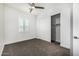 Bedroom features carpet, ceiling fan, closet, and white window shutters at 3822 E Canyon Pl, Chandler, AZ 85249