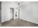 Bedroom with carpet, ceiling fan, closet, and a view of a bathroom at 3822 E Canyon Pl, Chandler, AZ 85249