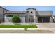 Contemporary home featuring desert landscaping, a modern facade, a tile roof and a three-car garage at 3822 E Canyon Pl, Chandler, AZ 85249