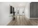 Bright foyer with wood-look tile flooring, white walls, and modern artwork at 3822 E Canyon Pl, Chandler, AZ 85249