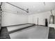 Bright garage featuring stylish flooring, clean white walls, and door leading to exterior at 3822 E Canyon Pl, Chandler, AZ 85249