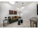 Living Room area featuring a couch, modern art, plants, and wood floors at 3822 E Canyon Pl, Chandler, AZ 85249