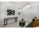 Living Room area featuring a couch, modern art, plants, and wood floors at 3822 E Canyon Pl, Chandler, AZ 85249