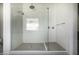 Large walk-in shower with white tile, glass surround, and dual shower heads at 3822 E Canyon Pl, Chandler, AZ 85249