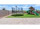 Backyard featuring artificial grass, a trampoline, and a play structure at 4091 W Suncup Dr, San Tan Valley, AZ 85144