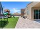 Landscaped backyard featuring a play structure, trampoline and mountain views at 4091 W Suncup Dr, San Tan Valley, AZ 85144