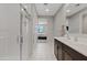This bathroom includes double sinks, a glass shower, and neutral paint at 4091 W Suncup Dr, San Tan Valley, AZ 85144