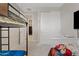 This bedroom features a bunk bed, closet, and an open door way at 4091 W Suncup Dr, San Tan Valley, AZ 85144