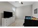 Bright bedroom with a dark-wood day bed, white dresser, and neutral walls at 4091 W Suncup Dr, San Tan Valley, AZ 85144