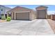 Charming single-story home with a three-car garage and a spacious driveway at 4091 W Suncup Dr, San Tan Valley, AZ 85144
