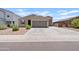 Beautiful home featuring manicured landscaping, a driveway, and a two-car garage at 4091 W Suncup Dr, San Tan Valley, AZ 85144