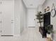 Entry way with tiled flooring, coat rack, and decorative plant at 4091 W Suncup Dr, San Tan Valley, AZ 85144