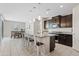Kitchen with an island featuring granite countertops and stainless steel appliances at 4091 W Suncup Dr, San Tan Valley, AZ 85144