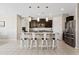 Kitchen with granite countertops, stainless steel appliances, and seating at the island at 4091 W Suncup Dr, San Tan Valley, AZ 85144