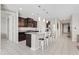 Well-equipped kitchen boasts granite countertops and a functional island with pendant lighting at 4091 W Suncup Dr, San Tan Valley, AZ 85144