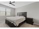 Main bedroom with a neutral color scheme, a large bed, and a ceiling fan at 4091 W Suncup Dr, San Tan Valley, AZ 85144