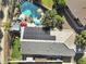 Expansive aerial view of property with a backyard pool, manicured landscaping, and solar panels at 4111 S Dewdrop Ct, Gilbert, AZ 85297