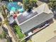 Aerial view of backyard featuring pool, solar panels, patio, and artificial turf at 4111 S Dewdrop Ct, Gilbert, AZ 85297