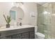 Modern bathroom featuring a dark wood vanity, granite countertop, and glass shower at 4111 S Dewdrop Ct, Gilbert, AZ 85297