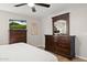 Comfortable bedroom showcasing dark wood furniture and bright natural light at 4111 S Dewdrop Ct, Gilbert, AZ 85297
