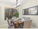 Cozy dining area with neutral colors, natural light, a table setting, and an outside view at 4111 S Dewdrop Ct, Gilbert, AZ 85297