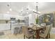 Open-concept kitchen and dining area with stainless steel appliances and a view of the backyard at 4111 S Dewdrop Ct, Gilbert, AZ 85297