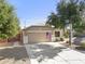 Exterior front view of home with a 2-car garage, landscaped yard and long driveway at 4111 S Dewdrop Ct, Gilbert, AZ 85297