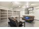 A finished garage provides a recreational space with a futball table and living area with seating at 4111 S Dewdrop Ct, Gilbert, AZ 85297
