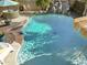 Backyard pool featuring a rock waterfall, hot tub and plenty of space to relax and entertain at 4111 S Dewdrop Ct, Gilbert, AZ 85297