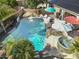 Backyard pool with umbrellas, a hot tub, and landscaping creates a perfect backyard oasis at 4111 S Dewdrop Ct, Gilbert, AZ 85297