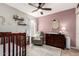 Charming Bedroom with a crib, dresser, changing table, and comfortable seating area at 4216 E Sandia St, Phoenix, AZ 85044