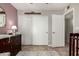 Charming bedroom featuring a dresser, closet, and doorway at 4216 E Sandia St, Phoenix, AZ 85044