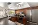 Updated kitchen with stainless steel appliances, dark cabinets, and lots of natural light at 4216 E Sandia St, Phoenix, AZ 85044