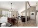 Open-concept living space with dining area, fireplace, vaulted ceilings, and abundant natural light at 4216 E Sandia St, Phoenix, AZ 85044