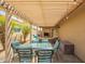 Inviting covered patio with dining area and string lights, perfect for outdoor entertaining at 4216 E Sandia St, Phoenix, AZ 85044