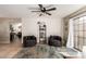 Cozy sitting room with stylish decor, comfortable seating, and a ceiling fan at 4216 E Sandia St, Phoenix, AZ 85044