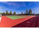 Brightly colored tennis courts for recreational enjoyment at 4216 E Sandia St, Phoenix, AZ 85044