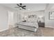 Comfortable main bedroom with a ceiling fan, hardwood floors and ample natural light at 4416 E Capistrano Ave, Phoenix, AZ 85044