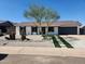 Charming single-story home with xeriscaped front yard, desert landscaping, and a two-car garage at 4416 E Capistrano Ave, Phoenix, AZ 85044